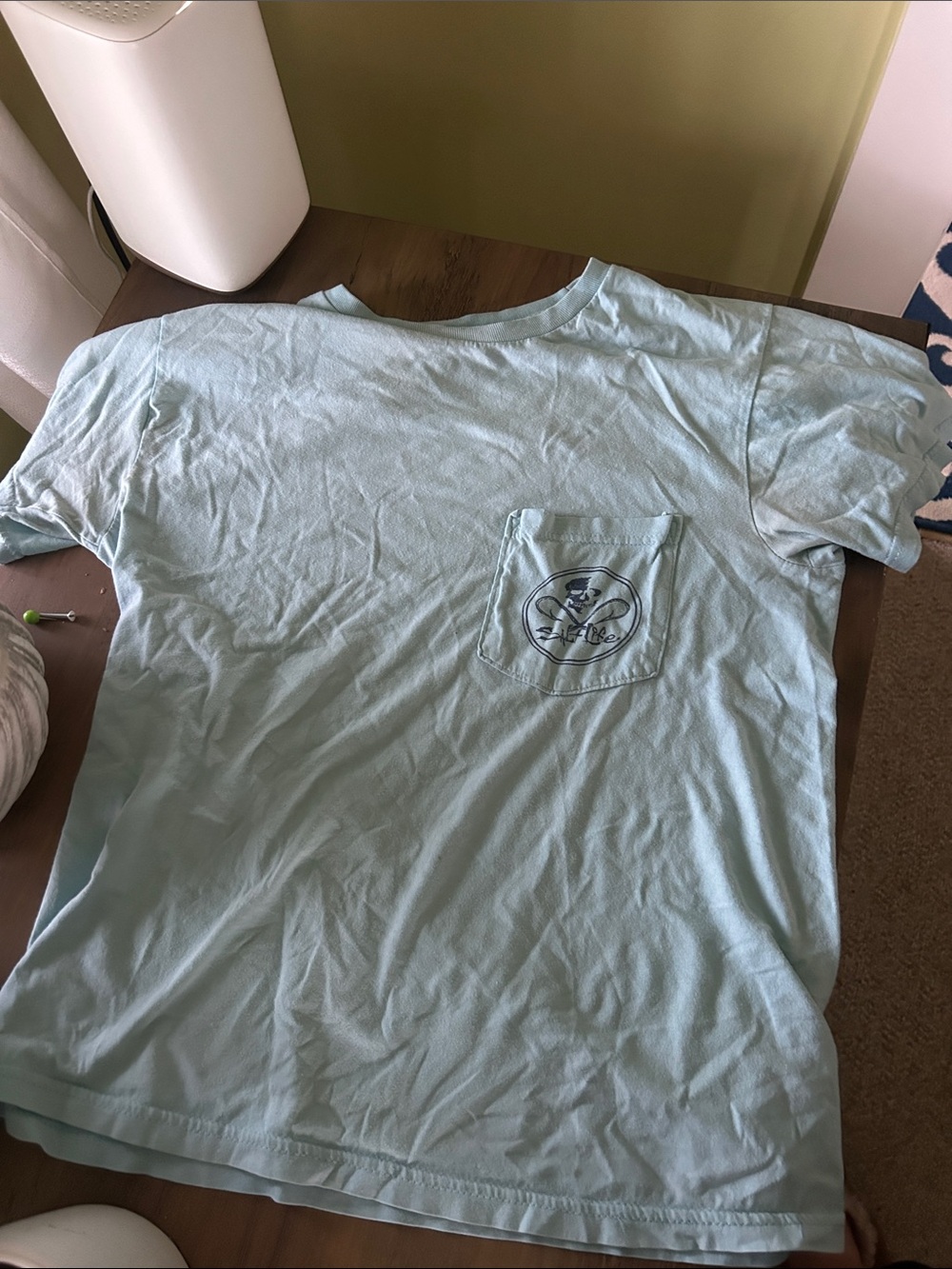 Light Blue salt life tee with pocket in the front